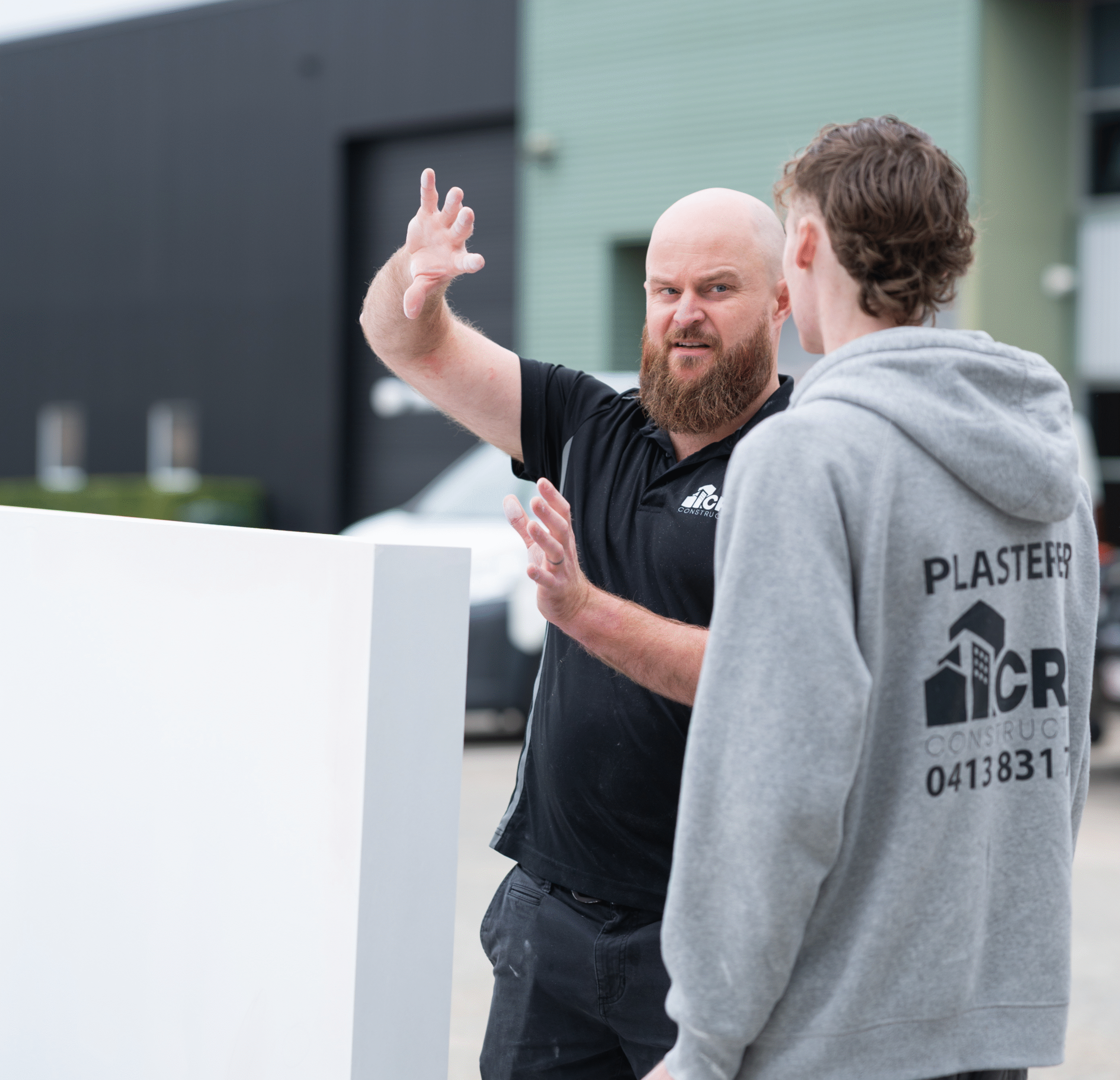 Chris, Managing Director at CRA Construction, a Brisbane plastering and interiors contractor on site facilitating an apprentice workshop development training session in Brisbane